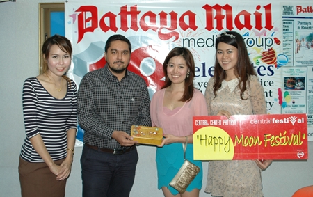 On the happy occasion of the Chinese Autumn Moon Festival, lovely moon angels descended on the offices of the Pattaya Mail to bring delicious moon cakes for the enjoyment of our staff. Prince Malhotra (2nd left), GM of the Pattaya Mail, is seen happily receiving the gift from the Central Festival Pattaya Beach angels (l-r) marketing executive Kusuma Ebata, senior marketing executive Chonnikarn Chaimaungmool, and promotion officer Pornthip Dubtook.